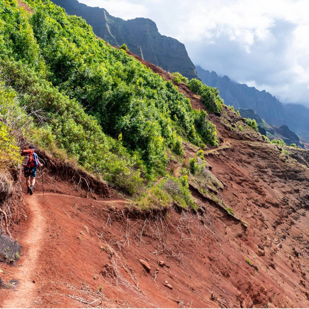 Hiker on the Kalalau Trail in Kauai, Hawaii