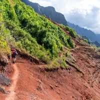 Hiker on the Kalalau Trail in Kauai, Hawaii