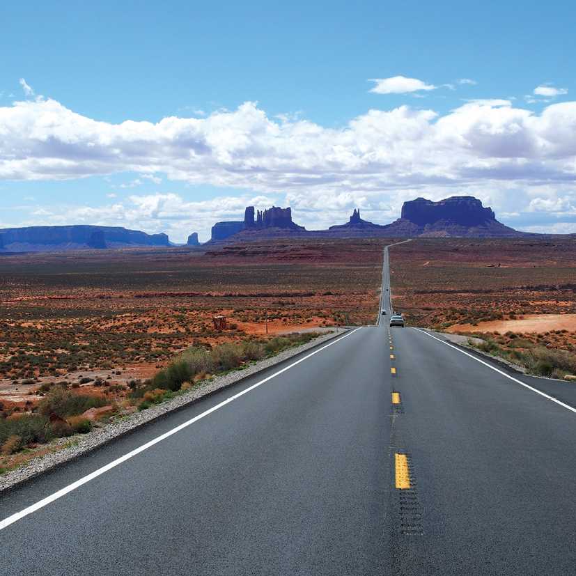 A long open road through Monument Valley | Jake Hutchins