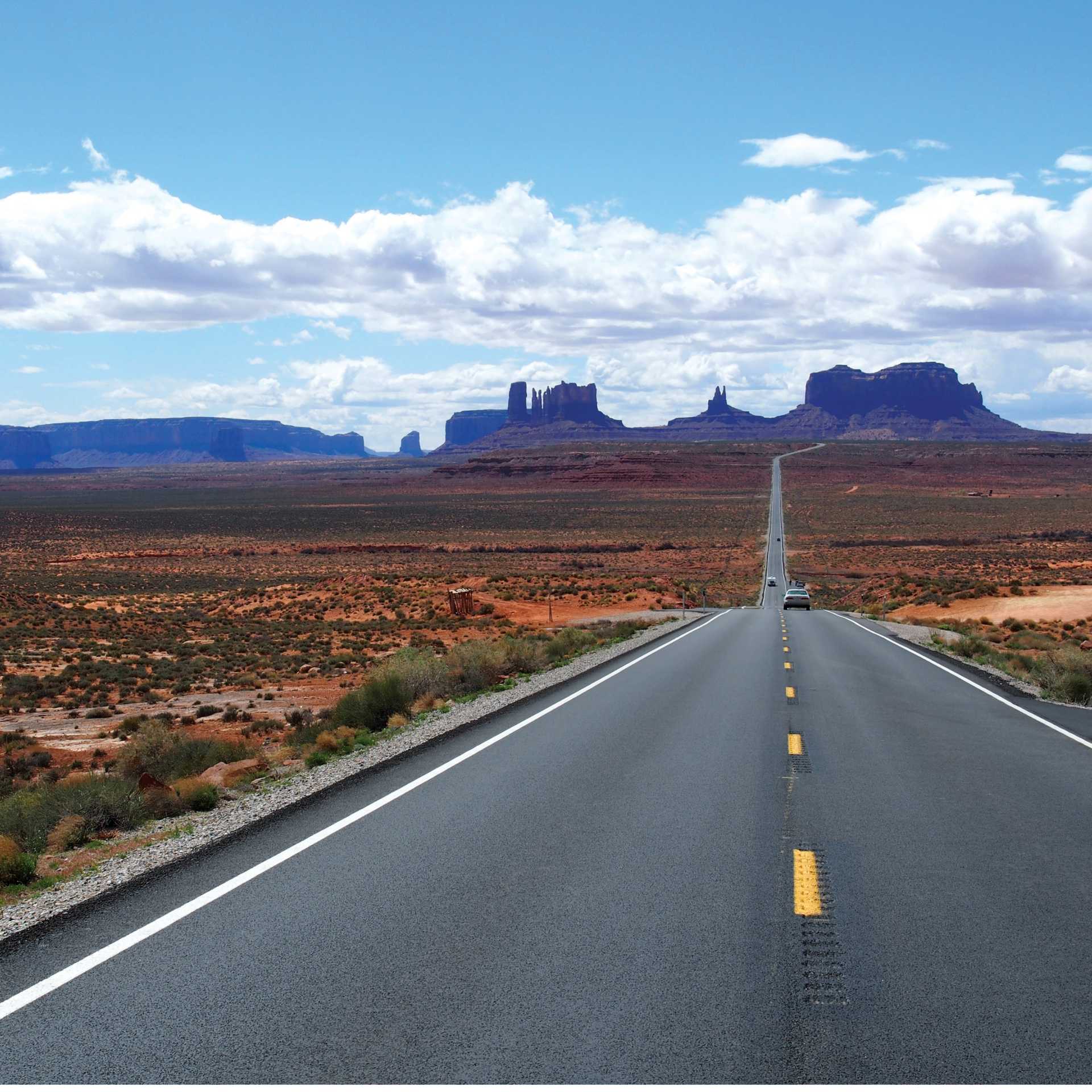 A long open road through Monument Valley | Jake Hutchins